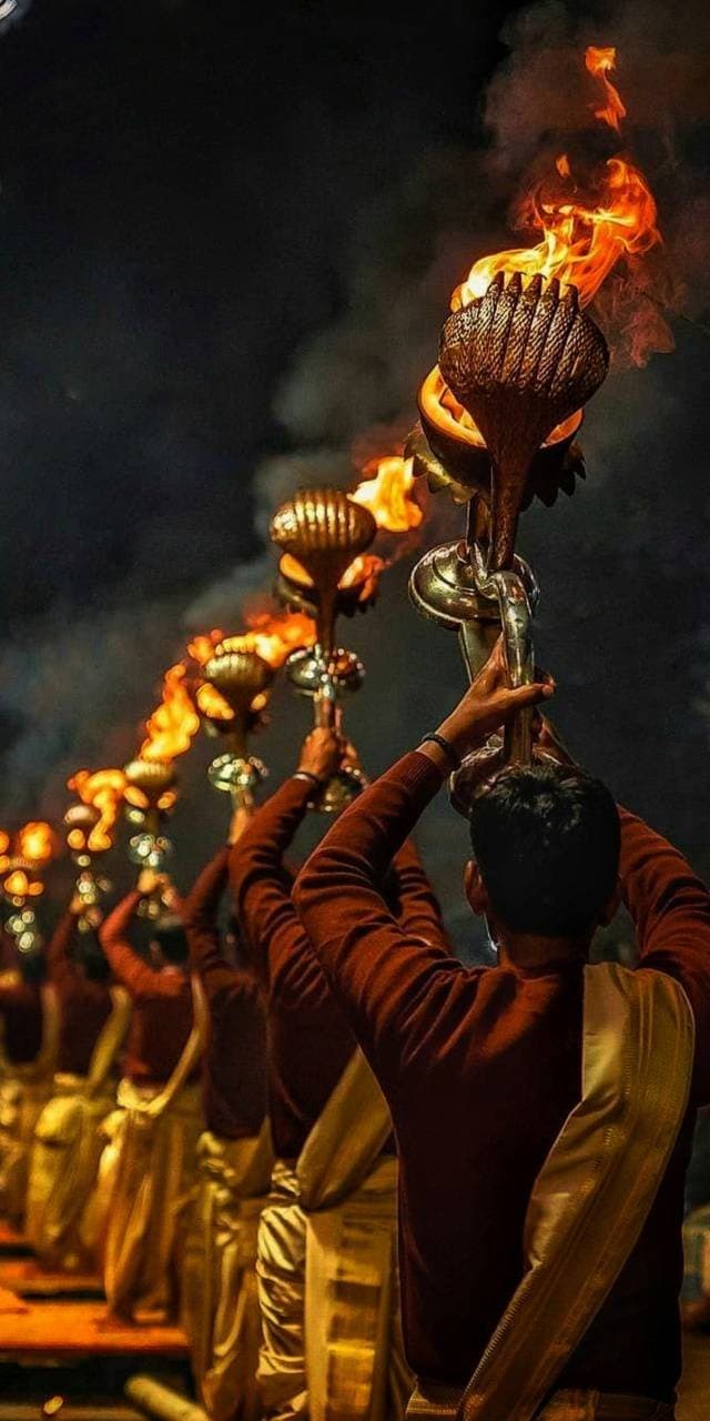 Aarti lamps glowing during a festival celebration